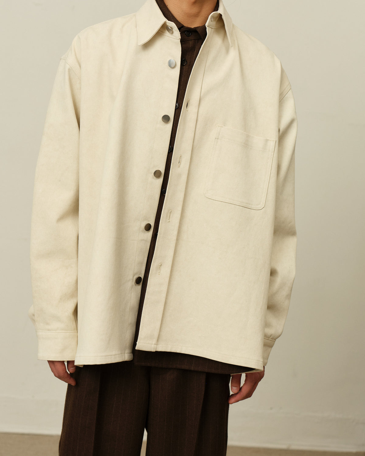 Colbo Overshirt in painted natural denim, on model, front detail