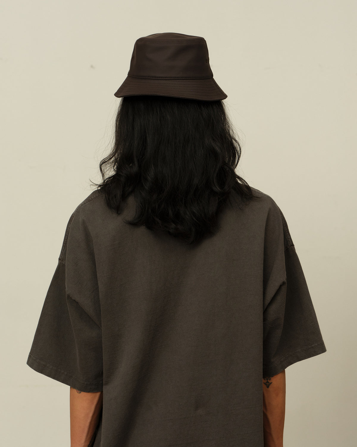 Colbo Bucket Hat in coated deep purple, on model, back