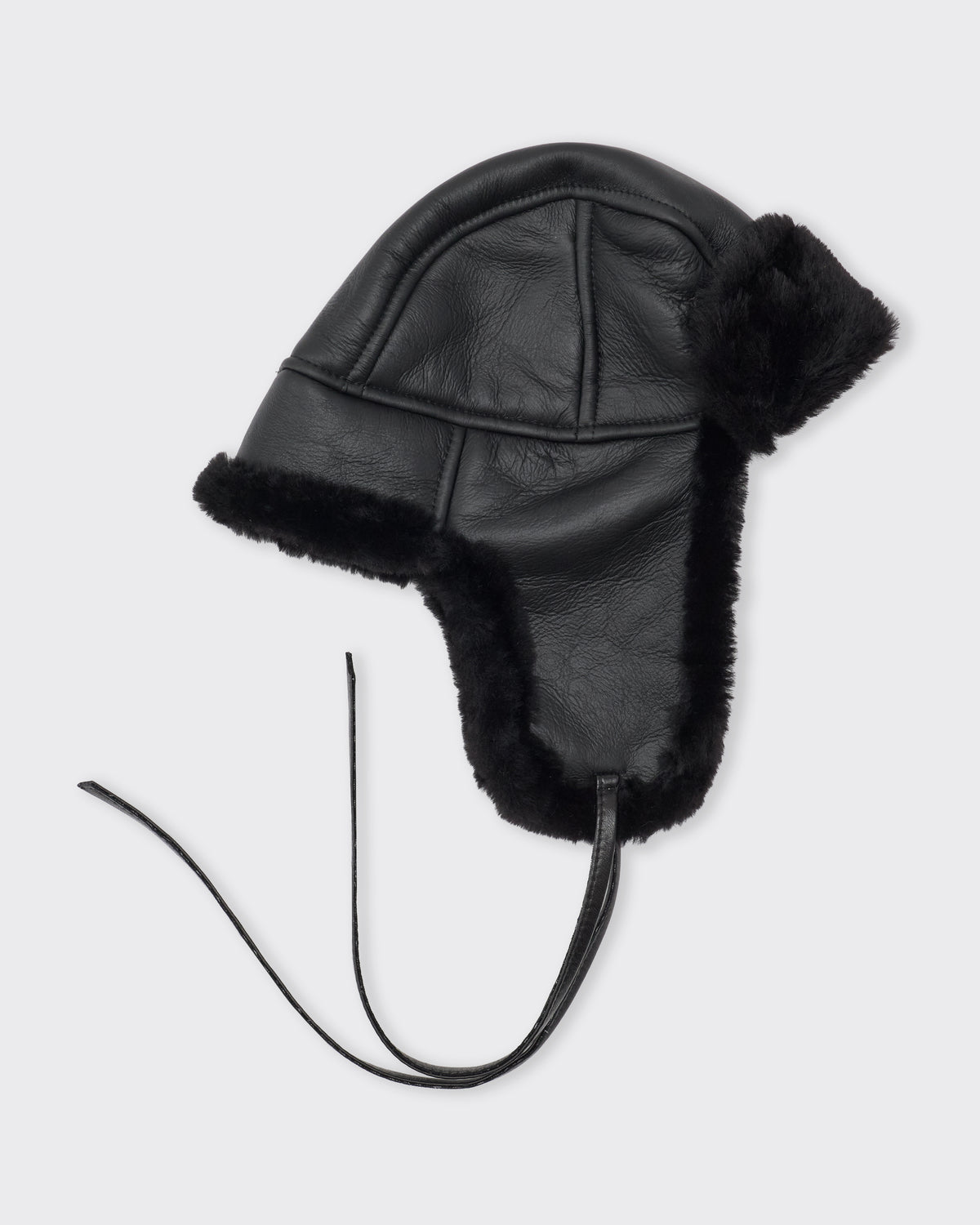 Cawley Leather Back Straight Hair Sheepskin Trapper Hat in black, side, ear flaps down
