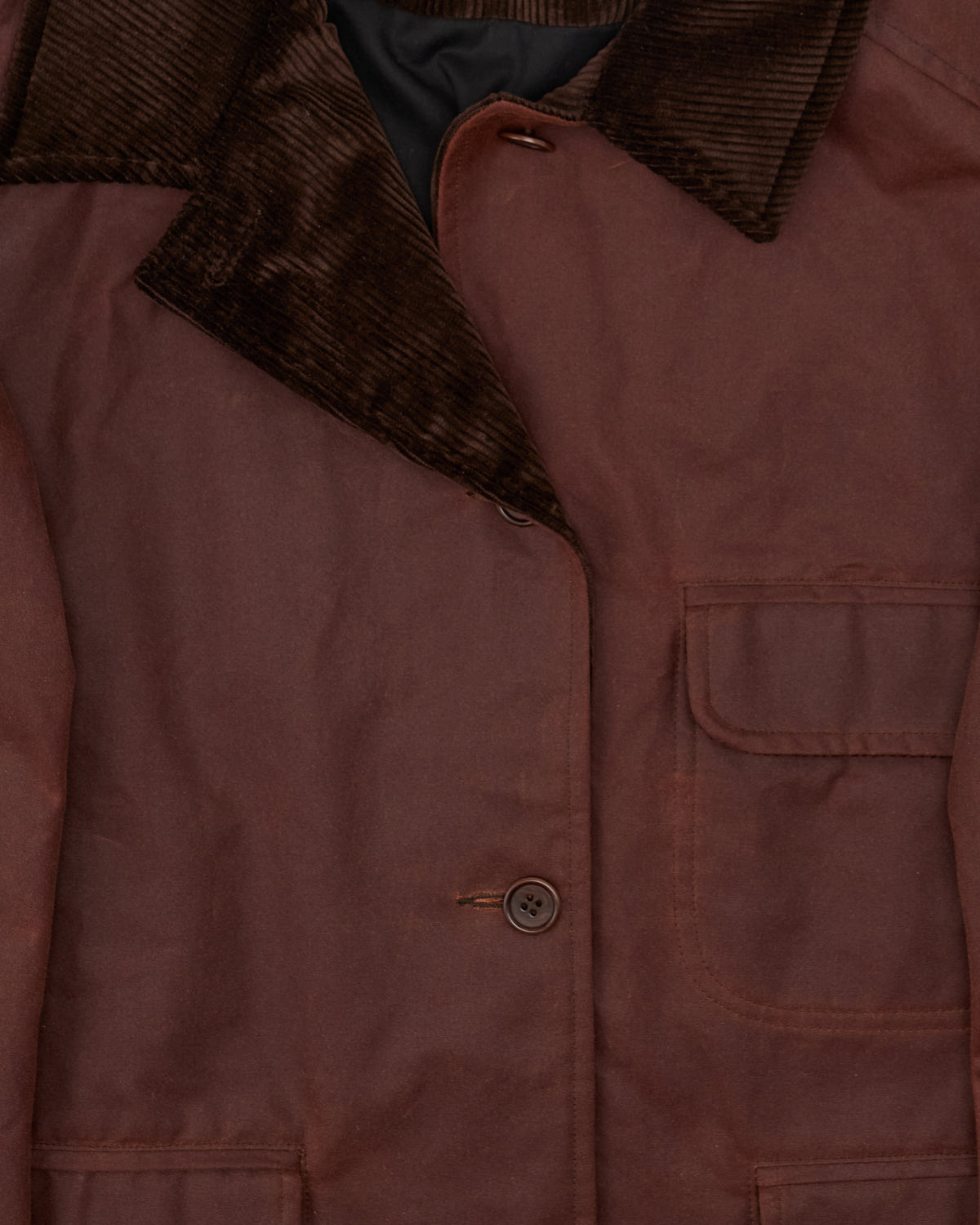 Cawley Waxed Oilskin Hunter Jacket in chestnut with chocolate cord collar, corduroy collar and pocket close-up