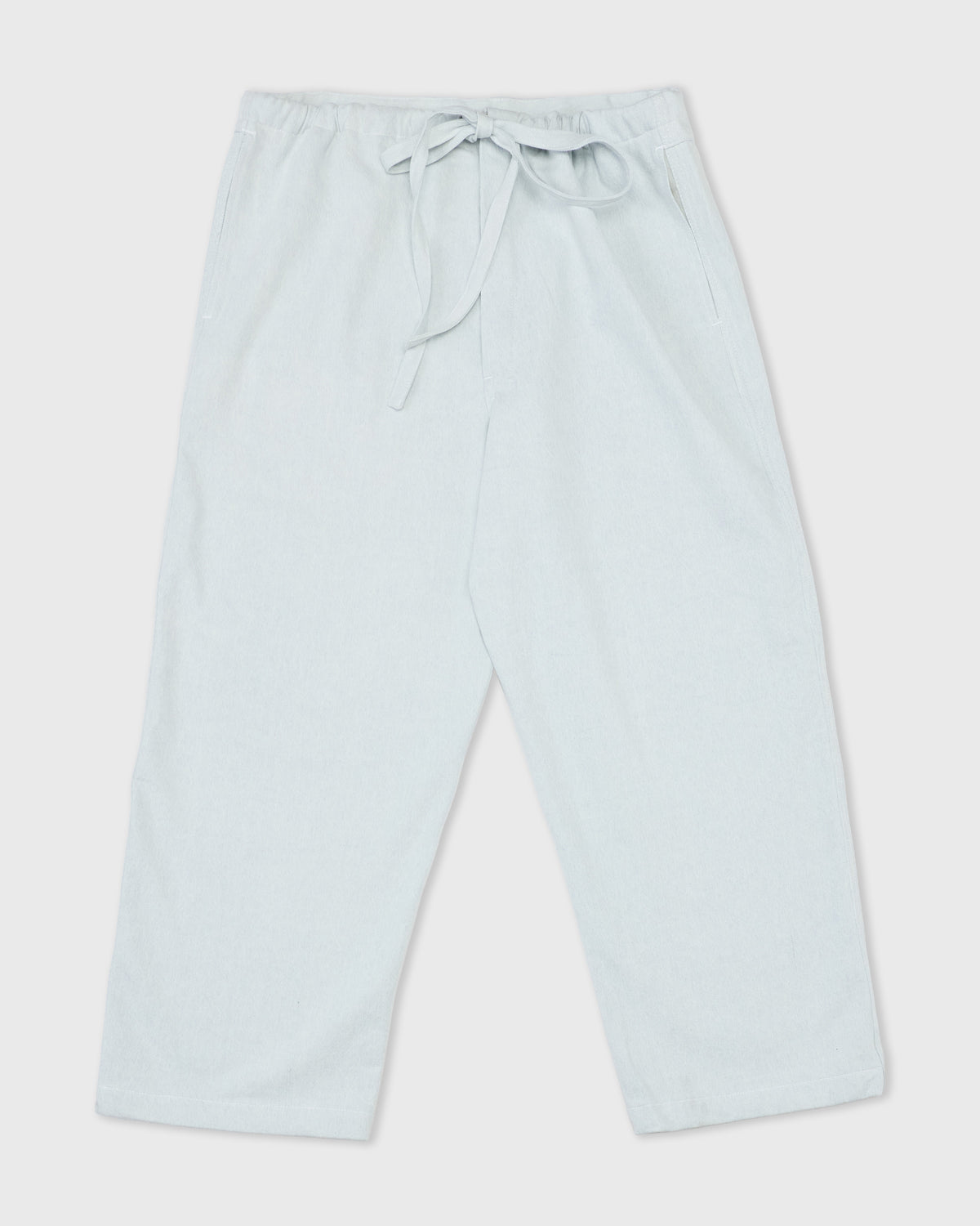 Colbo Farm Pants in summer blue cotton, front with drawstring tied, flat lay