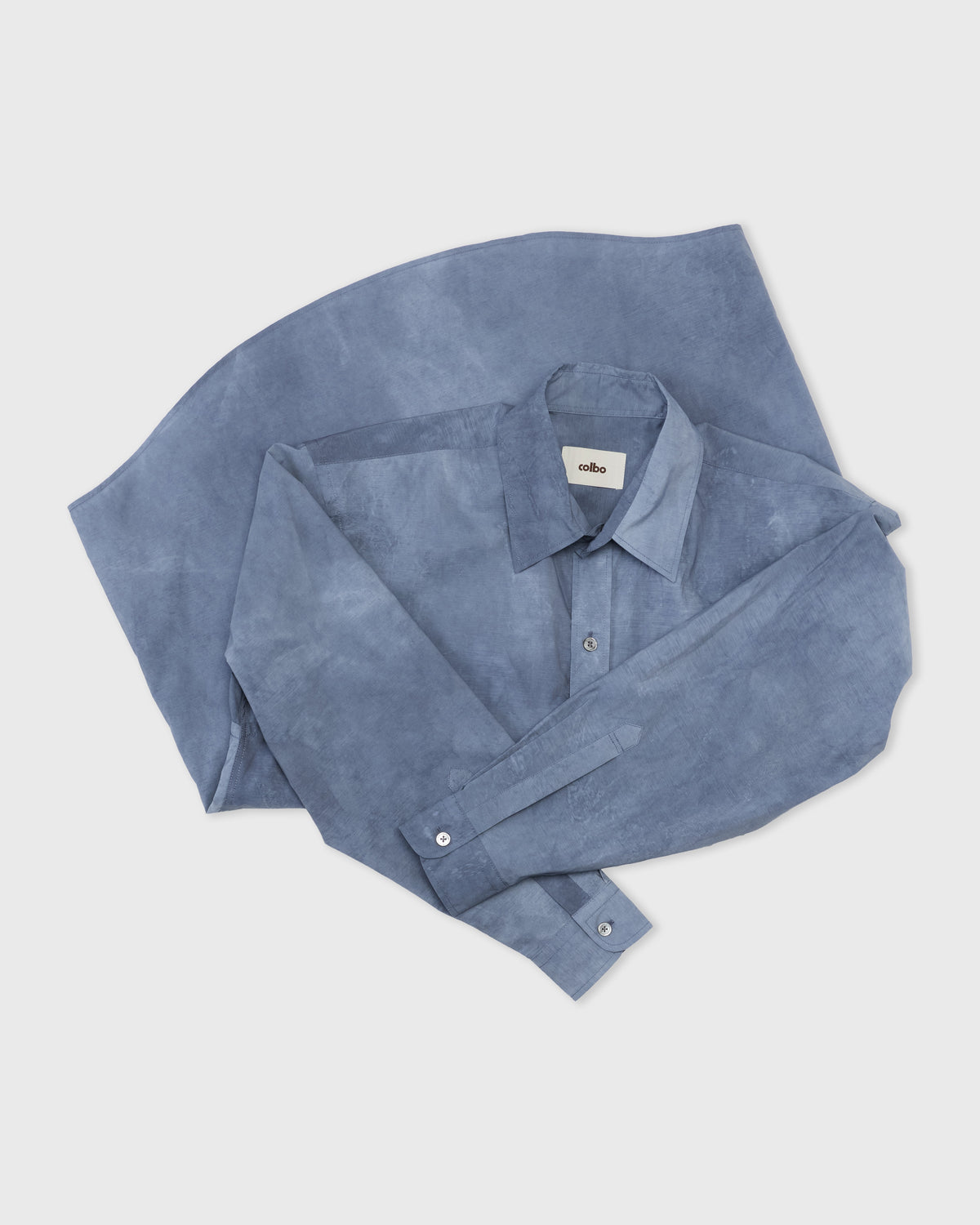 Colbo Office Shirt in washed blue cotton, folded, flat lay